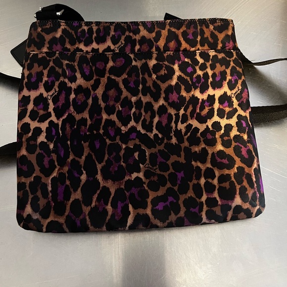 Coach Handbags - Coach cross body handbag leopard print comes with C.OA like new condition